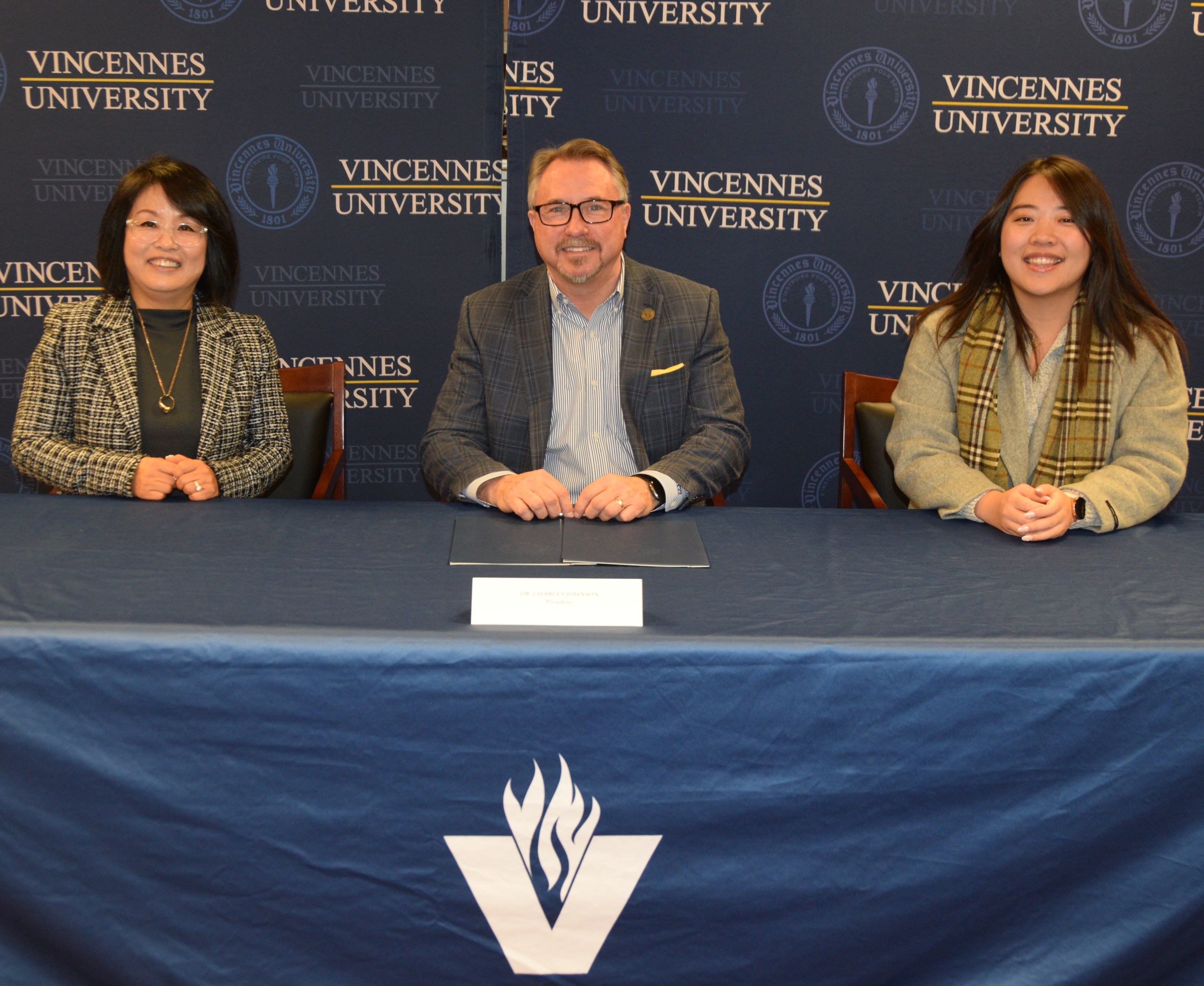 Dr. Elin Jung, Dr. Chuck Johnson and Esther Yoon during the signing of a MOU in the President's Office on the Vincennes Campus
